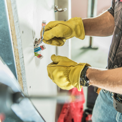 An electrician installing an outlet.