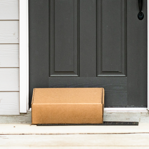 A delivered package at a doorstep.