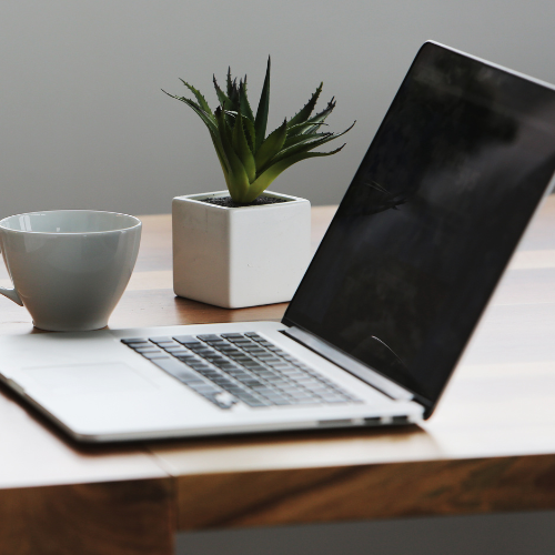 A close-up of a laptop on a desk.